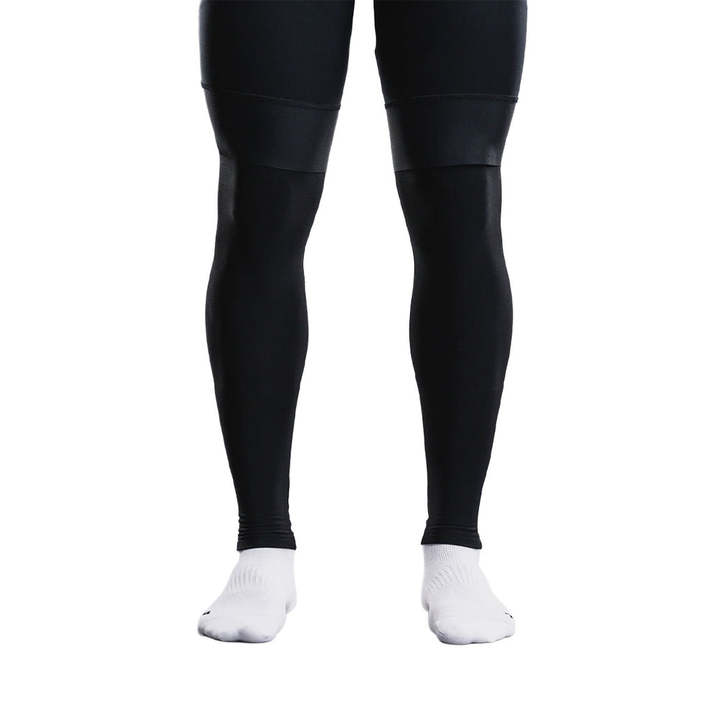 Sorte unisex benvarmere med fødder på sportssokker