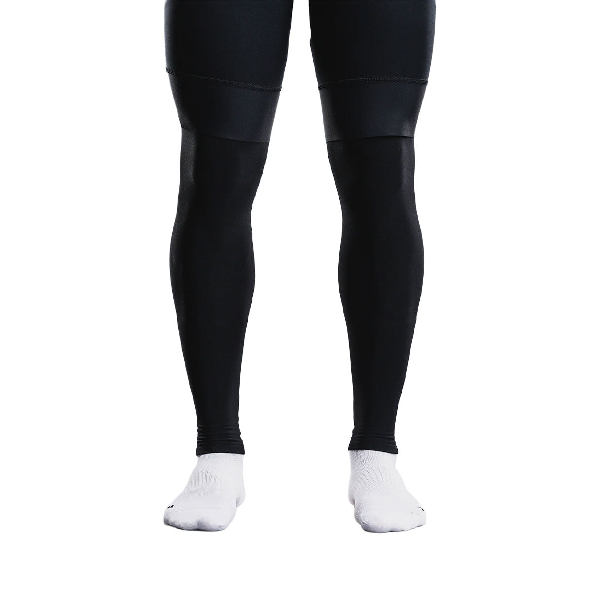 Sorte unisex benvarmere med fødder på sportssokker