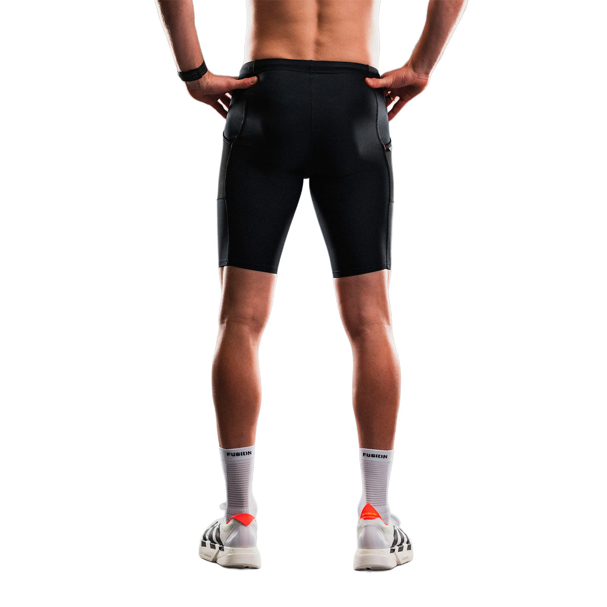 FUSION TEMPO unisex kort tight i sort med logo ved ankler