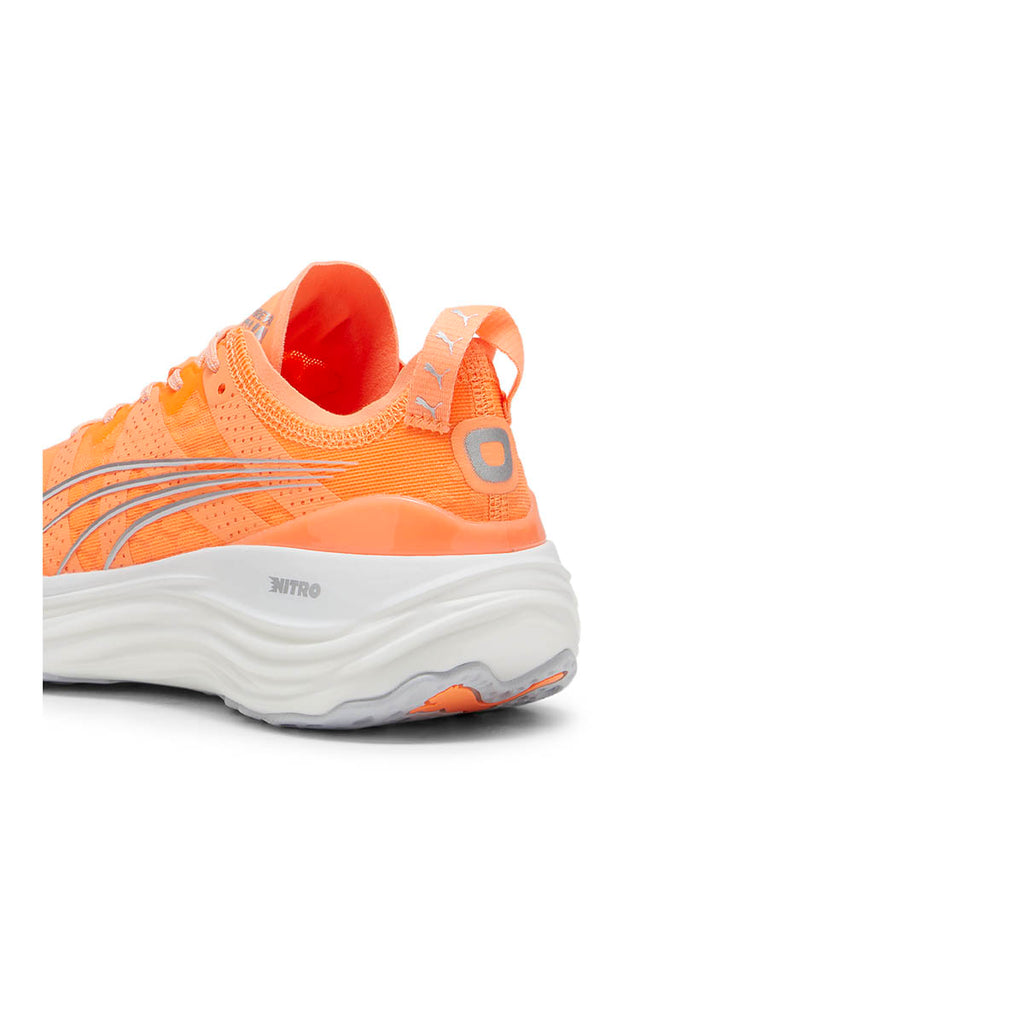 Puma ForeverRun NITRO women's running shoes in vibrant orange with reflective details.