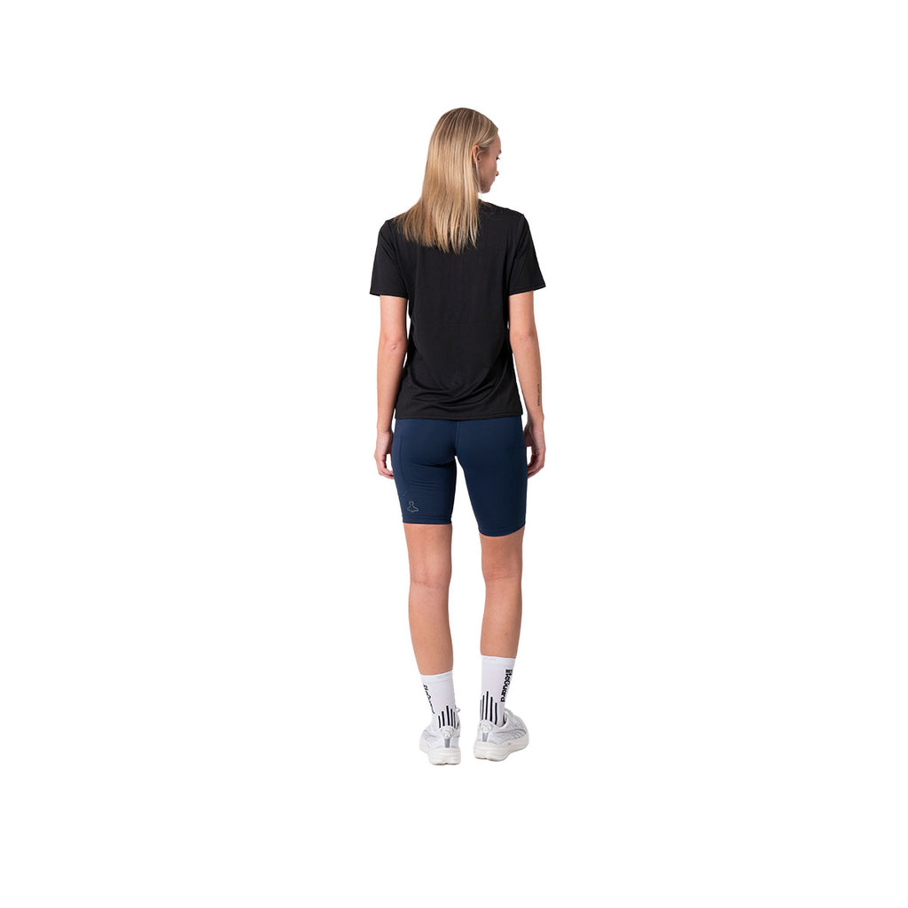 Kort tight dame i blå farve, set bagfra
