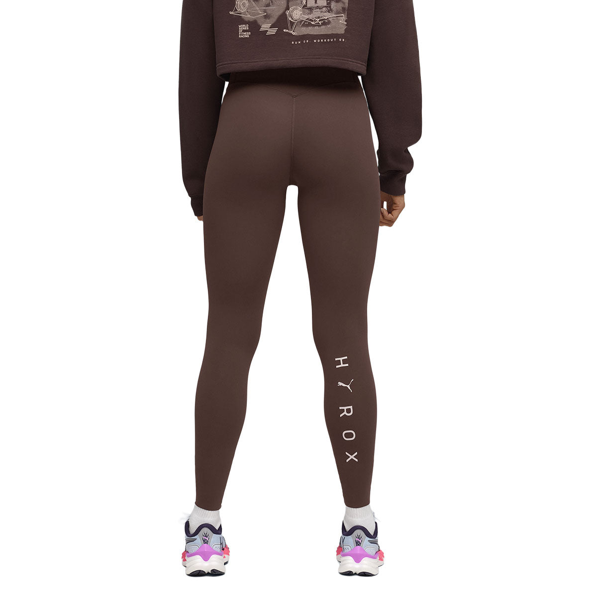 Brune lang tights fra Puma x Hyrox med logo på benet